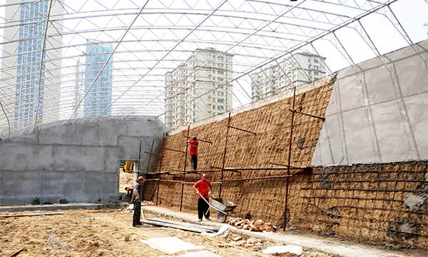 Practical and Highly Insulated Soil Wall Greenhouse Construction site